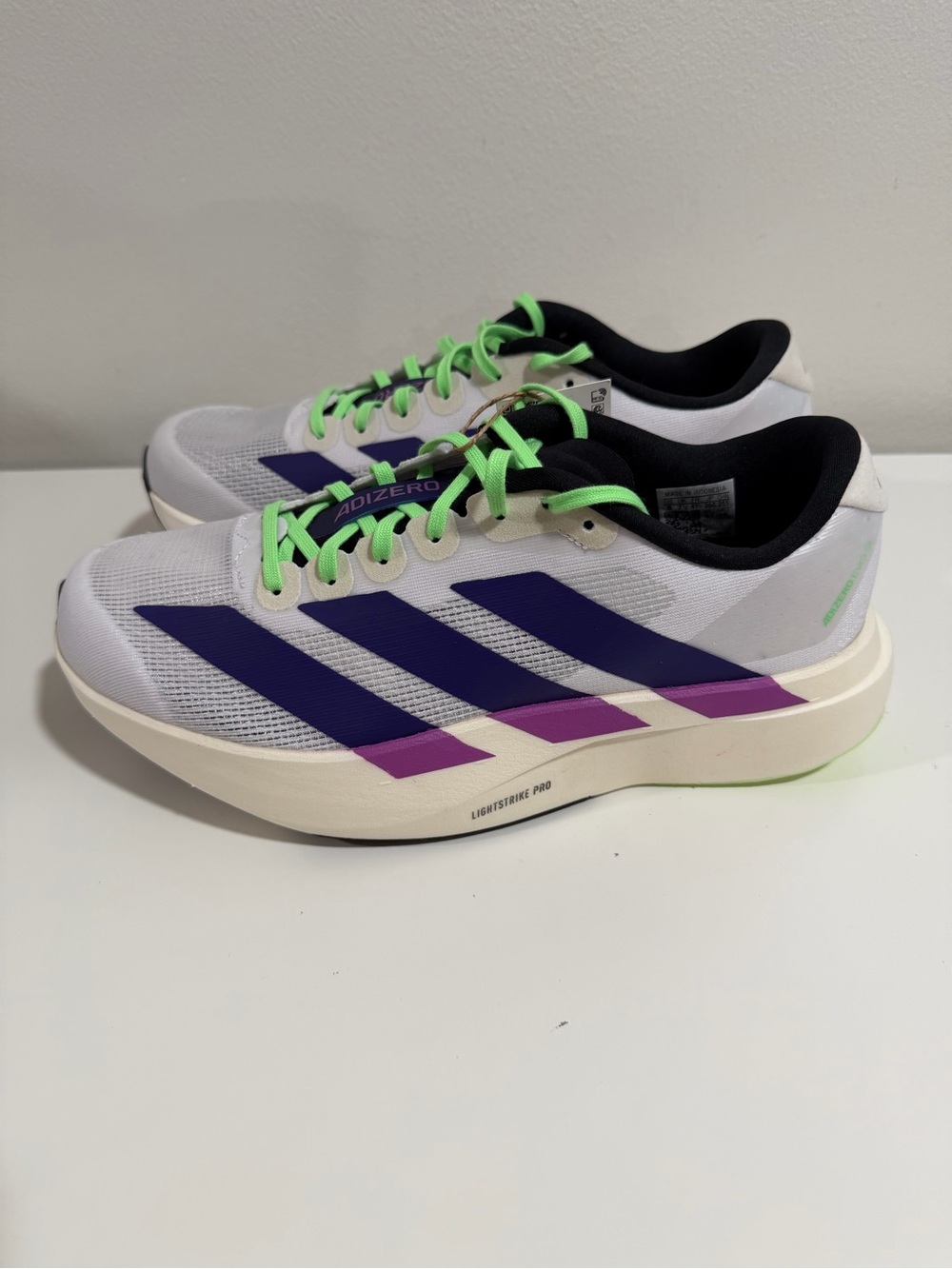 adidas White Running Shoes with Purple Stripes and Neon Green Laces